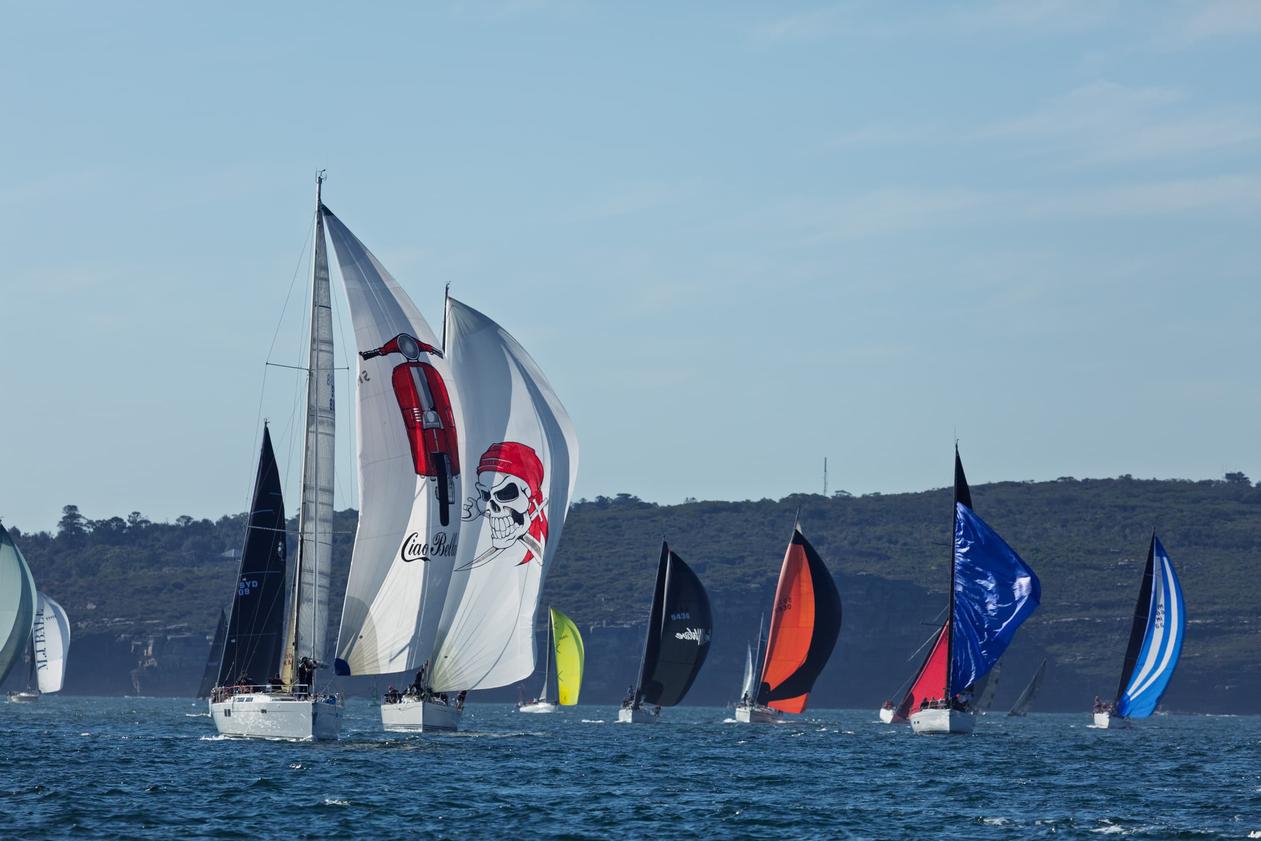 Sydney Harbour Winter Series fleet running downwind under spinnaker